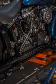 Chrome center stand fitted to a Harley-Davidson Softail